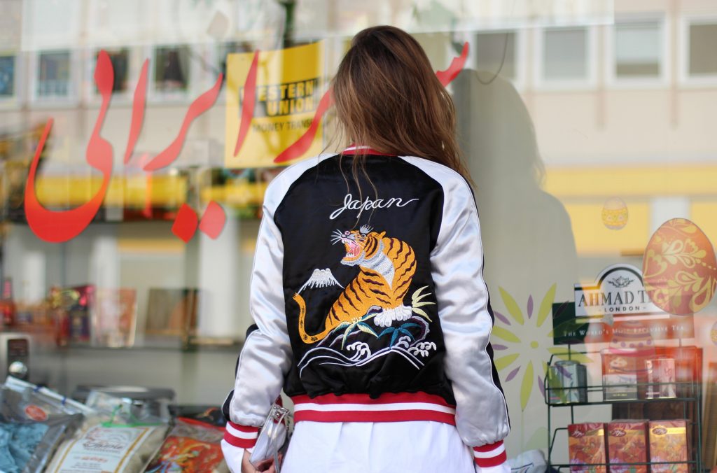 Topshop, Miu Miu, Louis Vuitton, Cutler and Cross, Celine, Levi's, Bernard Delettrez Alexandra Lapp wearing a bomber jacket from Topshop, Miu Miu, Louis Vuitton, Cutler and Cross, Celine, Levi's, Bernard Delettrez