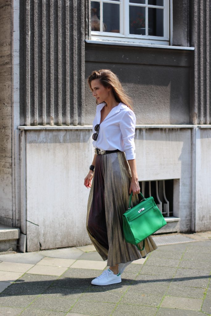 Alexandra Lapp wearing a pleated skirt from Max & Co., Adidas, Steffen Schraut, Hermès, Monokel Eyewear