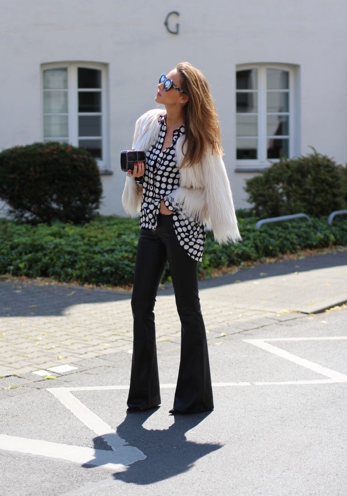 DÜSSELDORF; GERMANY - NOVEMBER : German model and fashion blogger Alexandra Lapp (@alexandralapp_) wearing Polka dots on a blouse from Steffen Schraut, flared leather pants from Tigha, faux fur from Steffen Schraut, Les Specs sunglasses, Gianvito Rossi shoes and Chanel bag on November, 2016 in Germany*** Local Caption *** Alexandra Lapp