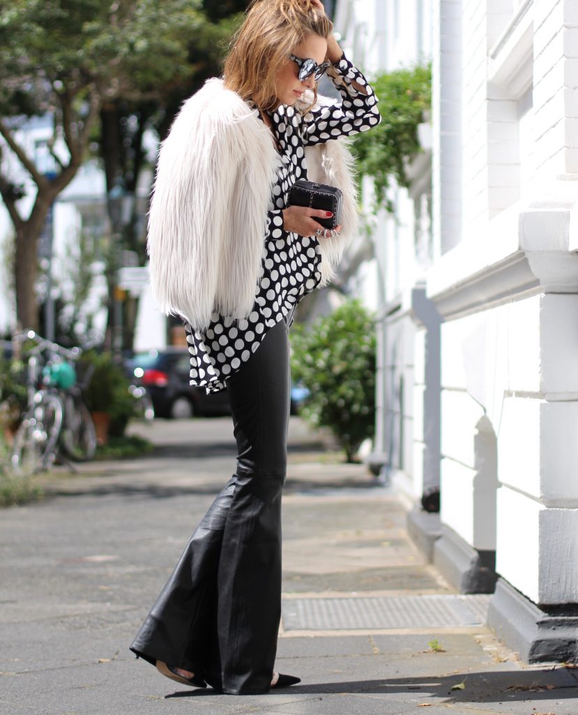 DÜSSELDORF; GERMANY - NOVEMBER : German model and fashion blogger Alexandra Lapp (@alexandralapp_) wearing Polka dots on a blouse from Steffen Schraut, flared leather pants from Tigha, faux fur from Steffen Schraut, Les Specs sunglasses, Gianvito Rossi shoes and Chanel bag on November, 2016 in Germany*** Local Caption *** Alexandra Lapp
