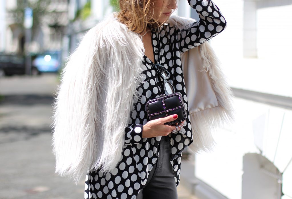 DÜSSELDORF; GERMANY - NOVEMBER : German model and fashion blogger Alexandra Lapp (@alexandralapp_) wearing Polka dots on a blouse from Steffen Schraut, flared leather pants from Tigha, faux fur from Steffen Schraut, Les Specs sunglasses, Gianvito Rossi shoes and Chanel bag on November, 2016 in Germany*** Local Caption *** Alexandra Lapp