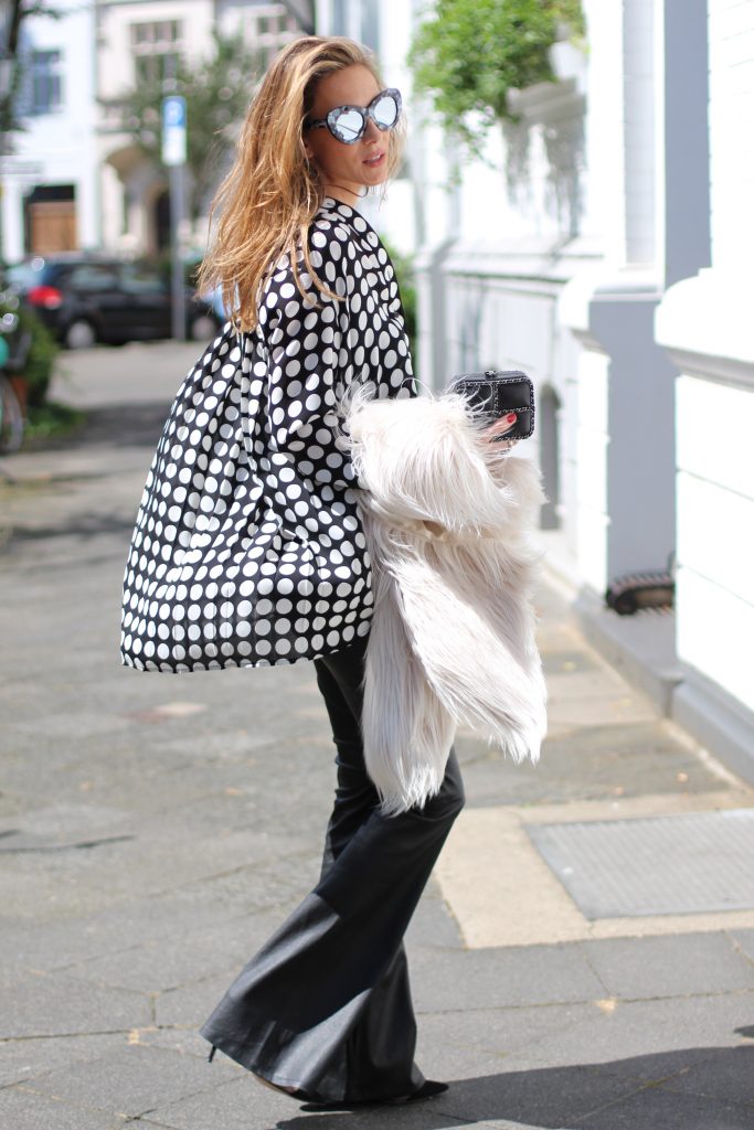 DÜSSELDORF; GERMANY - NOVEMBER : German model and fashion blogger Alexandra Lapp (@alexandralapp_) wearing Polka dots on a blouse from Steffen Schraut, flared leather pants from Tigha, faux fur from Steffen Schraut, Les Specs sunglasses, Gianvito Rossi shoes and Chanel bag on November, 2016 in Germany*** Local Caption *** Alexandra Lapp