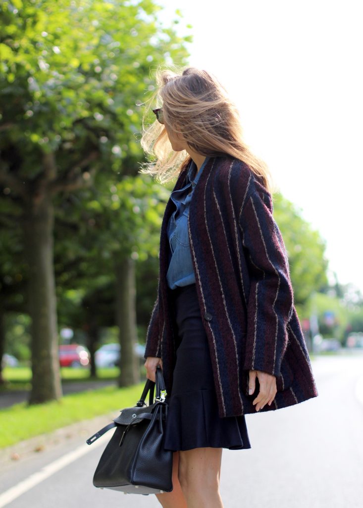 Alexandra Lapp wearing College Set, collage jacket and skirt by SET, Asos denim blouse, Hermès Kelly bag, Ray Ban sunglasses and Gianvito Rossi ankle boots. 