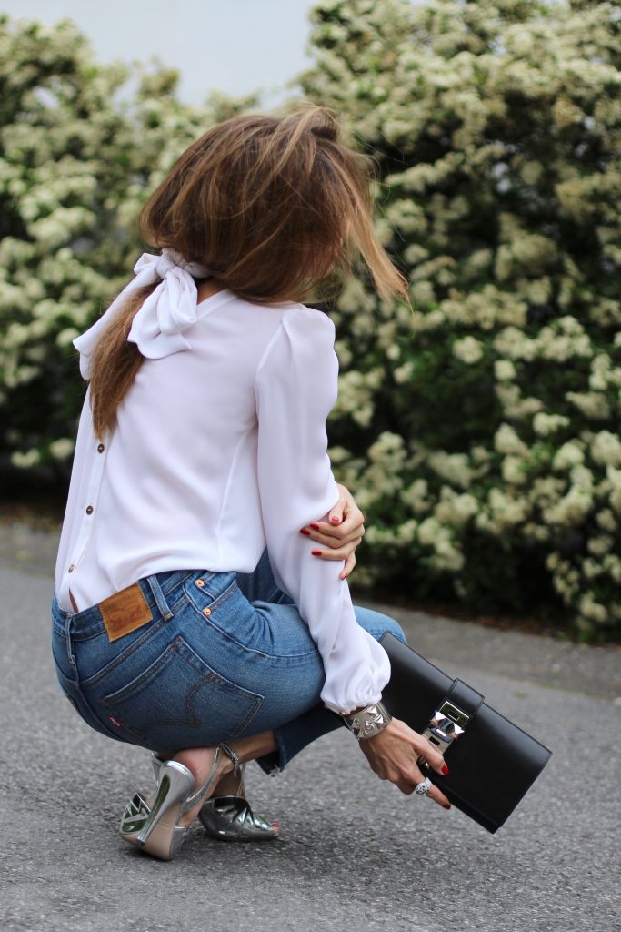 Emilio Pucci, Levi's, Miu Miu, Céline, Hermès Alexandra Lapp wearing a tie neck blouse from Emilio Pucci, Levi's, Miu Miu, Céline, Hermès