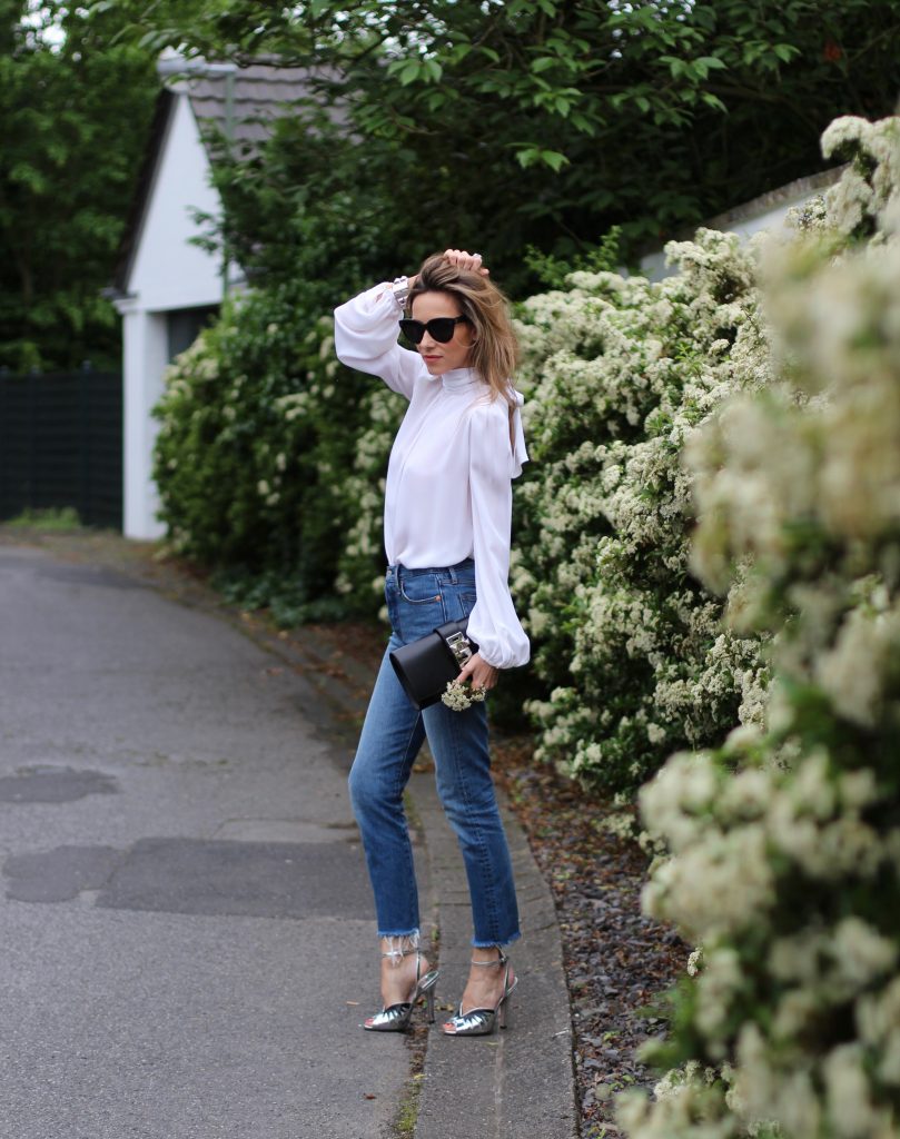 Emilio Pucci, Levi's, Miu Miu, Céline, Hermès Alexandra Lapp wearing a tie neck blouse from Emilio Pucci, Levi's, Miu Miu, Céline, Hermès
