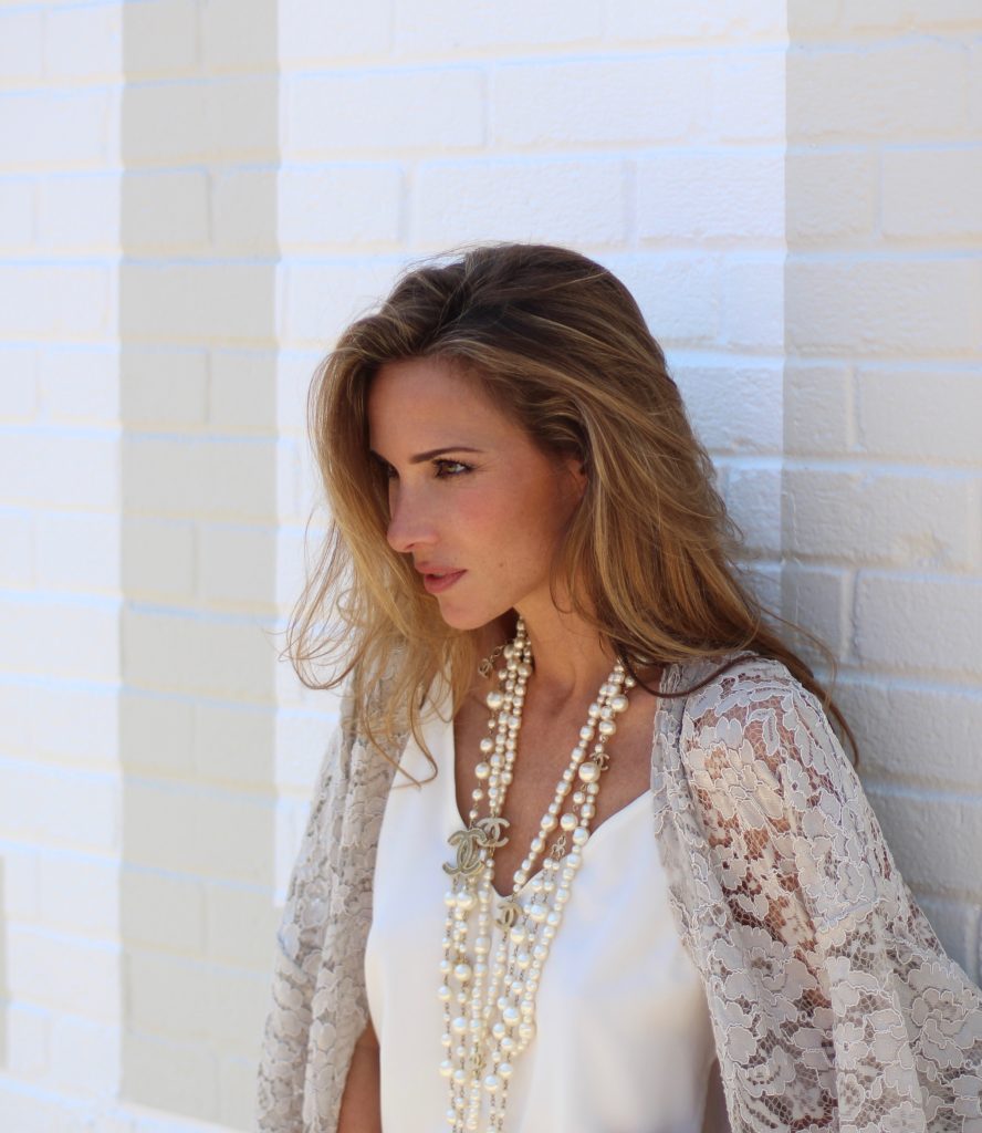 Alexandra Lapp wearing SET, Levi's, Christian Louboutin, Chanel, Chrome Hearts in front of Walls of Los Angeles.