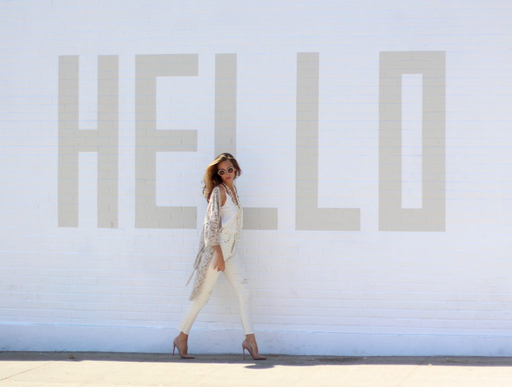 Alexandra Lapp wearing SET, Levi's, Christian Louboutin, Chanel, Chrome Hearts in front of Walls of Los Angeles.