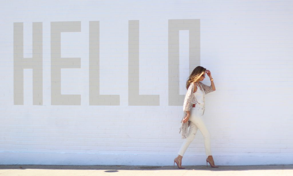 Alexandra Lapp wearing SET, Levi's, Christian Louboutin, Chanel, Chrome Hearts in front of Walls of Los Angeles.