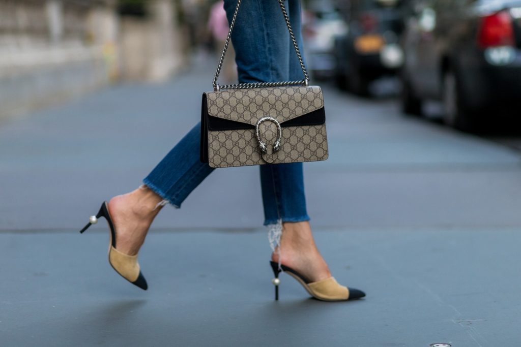 trench cape from SET, Levis denim jeans, Chanel shoes, Gucci bag and Chloe sunglasses NEW YORK, NY - SEPTEMBER 13: German fashion blogger and model Alexandra Lapp (@alexandralapp_) wearing a trench cape from SET, Levis denim jeans, Chanel shoes, Gucci bag and Chloe sunglasses on September 13, 2016 in New York City. (Photo by Christian Vierig/Getty Images) *** Local Caption *** Alexandra Lapp