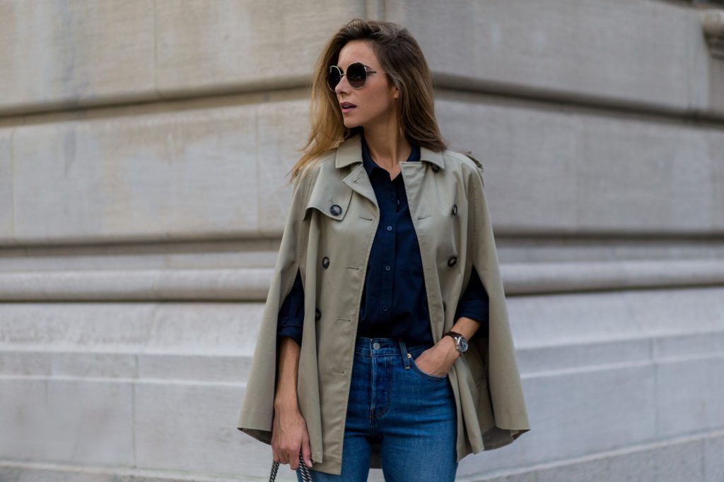trench cape from SET, Levis denim jeans, Chanel shoes, Gucci bag and Chloe sunglasses NEW YORK, NY - SEPTEMBER 13: German fashion blogger and model Alexandra Lapp (@alexandralapp_) wearing a trench cape from SET, Levis denim jeans, Chanel shoes, Gucci bag and Chloe sunglasses on September 13, 2016 in New York City. (Photo by Christian Vierig/Getty Images) *** Local Caption *** Alexandra Lapp