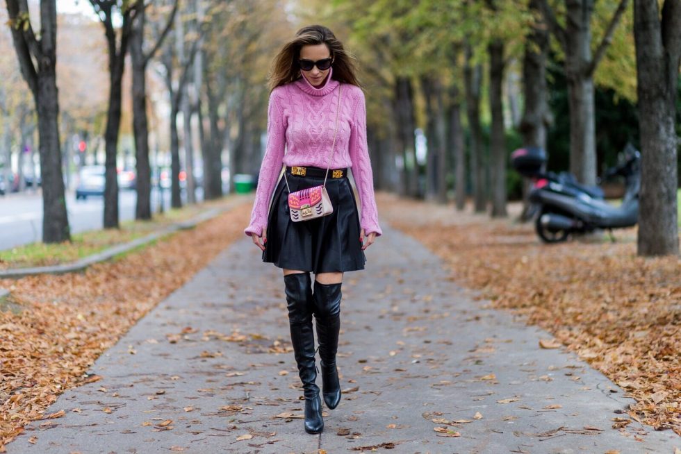 PARIS, FRANCE - OCTOBER 01: German model and fashion blogger Alexandra Lapp (@alexandralapp_) wearing a pink sweater from Jil Sander, leather pleated skirt from Steffen Schraut, overknees from Alaia, Celine sunglasses, Hermes belt, pink Furla bag on October 1, 2016 in Paris, France. (Photo by Christian Vierig/Getty Images) *** Local Caption *** Alexandra Lapp
