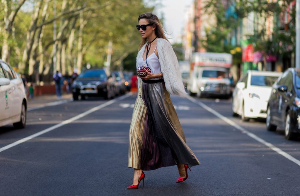 Alexandra Lapp wearing a metallic skirt by Max & Co., silk top by Jadicted, faux fur jacket by Steffen Schraut, pumps by Gianvito Rossi, clutch by Alexander McQueen, sunglasses by Céline in New York during NYFW.