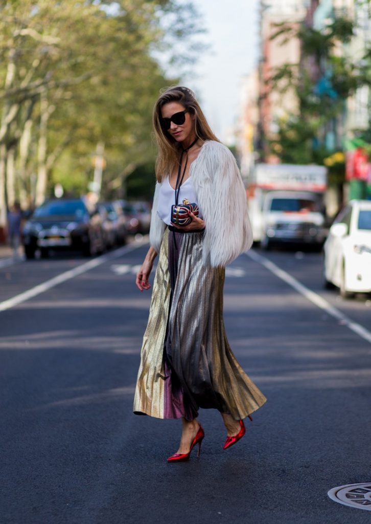Alexandra Lapp wearing a metallic skirt by Max & Co., silk top by Jadicted, faux fur jacket by Steffen Schraut, pumps by Gianvito Rossi, clutch by Alexander McQueen, sunglasses by Céline in New York during NYFW.
