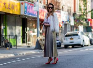 Alexandra Lapp wearing a metallic skirt by Max & Co., silk top by Jadicted, faux fur jacket by Steffen Schraut, pumps by Gianvito Rossi, clutch by Alexander McQueen, sunglasses by Céline in New York during NYFW.
