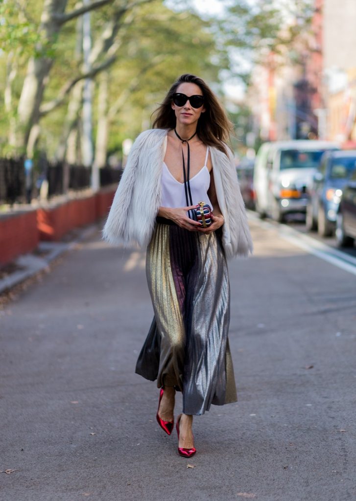 Alexandra Lapp wearing a metallic skirt by Max & Co., silk top by Jadicted, faux fur jacket by Steffen Schraut, pumps by Gianvito Rossi, clutch by Alexander McQueen, sunglasses by Céline in New York during NYFW.