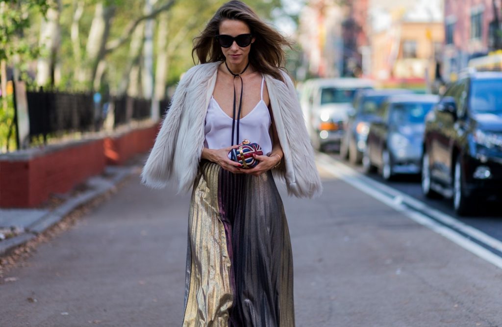 Alexandra Lapp wearing a metallic skirt by Max & Co., silk top by Jadicted, faux fur jacket by Steffen Schraut, pumps by Gianvito Rossi, clutch by Alexander McQueen, sunglasses by Céline in New York during NYFW.