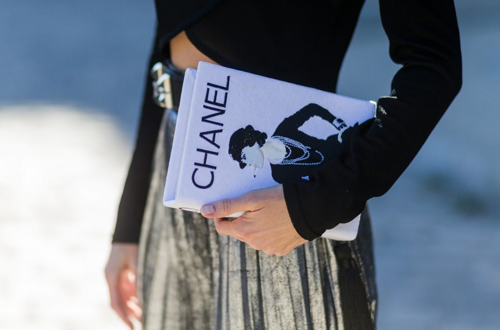 PARIS, FRANCE - OCTOBER 03: German fashion blogger and model Alexandra Lapp (@alexandralapp_) wearing Parisian Chic, a black sweater from Balmain, pleated skirt from Zara, Saint Laurent pumps, Gucci hat and selfmade bag with the print Chanel on October 3, 2016 in Paris, France. (Photo by Christian Vierig/Getty Images) *** Local Caption *** Alexandra Lapp