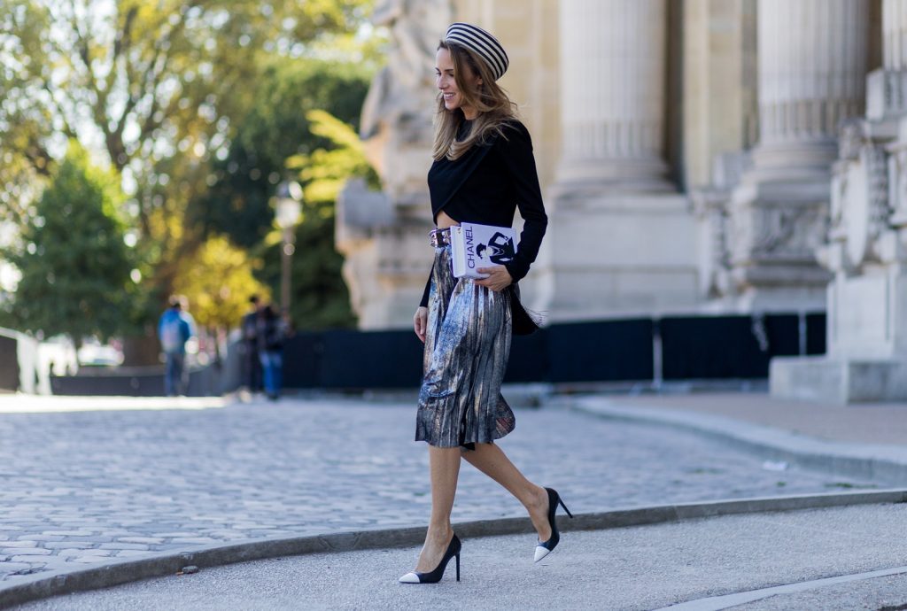 PARIS, FRANCE - OCTOBER 03: German fashion blogger and model Alexandra Lapp (@alexandralapp_) wearing Parisian Chic, a black sweater from Balmain, pleated skirt from Zara, Saint Laurent pumps, Gucci hat and selfmade bag with the print Chanel on October 3, 2016 in Paris, France. (Photo by Christian Vierig/Getty Images) *** Local Caption *** Alexandra Lapp