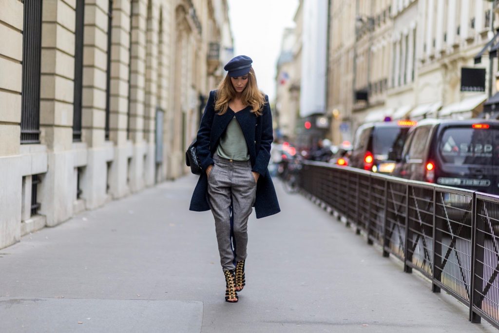 PARIS, FRANCE - SEPTEMBER 30: German fashion blogger and model Alexandra Lapp (@alexandralapp_) wearing Navy Coature, a blouse, grey pants, navy coat and hat from Marc Aurel, strap sandals from Balmain H&M and black Chanel backpack on September 30, 2016 in Paris, France. (Photo by Christian Vierig/Getty Images) *** Local Caption *** Alexandra Lapp