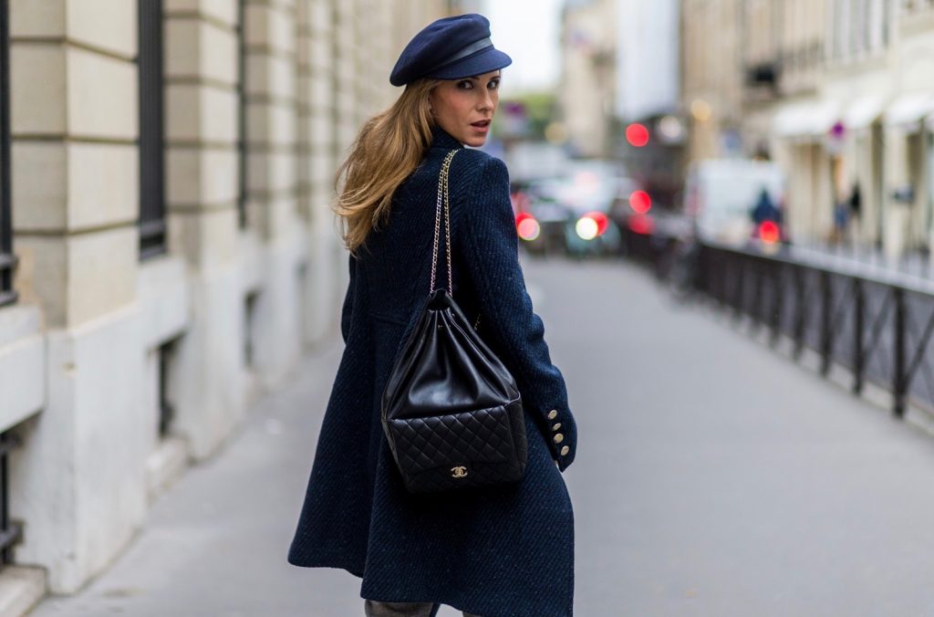 PARIS, FRANCE - SEPTEMBER 30: German fashion blogger and model Alexandra Lapp (@alexandralapp_) wearing Navy Coature, a blouse, grey pants, navy coat and hat from Marc Aurel, strap sandals from Balmain H&M and black Chanel backpack on September 30, 2016 in Paris, France. (Photo by Christian Vierig/Getty Images) *** Local Caption *** Alexandra Lapp