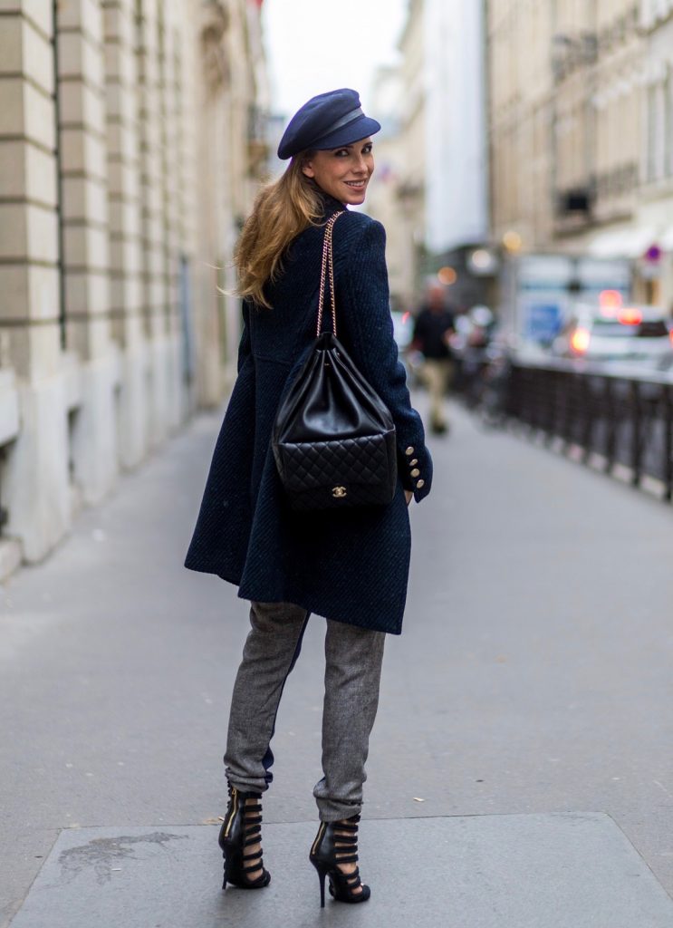 PARIS, FRANCE - SEPTEMBER 30: German fashion blogger and model Alexandra Lapp (@alexandralapp_) wearing Navy Coature, a blouse, grey pants, navy coat and hat from Marc Aurel, strap sandals from Balmain H&M and black Chanel backpack on September 30, 2016 in Paris, France. (Photo by Christian Vierig/Getty Images) *** Local Caption *** Alexandra Lapp