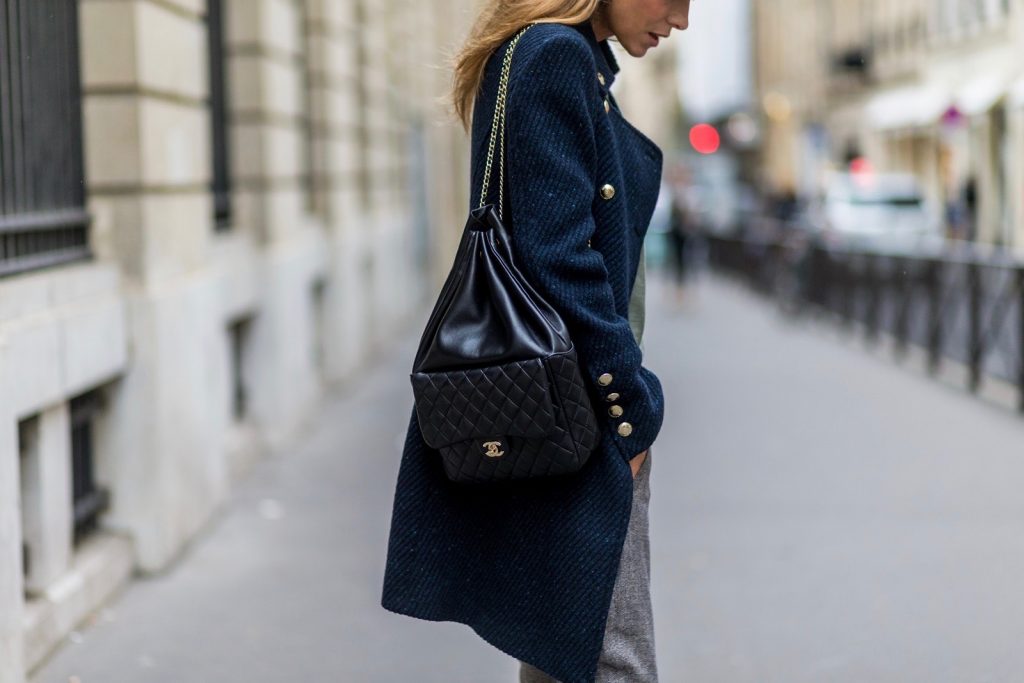 PARIS, FRANCE - SEPTEMBER 30: German fashion blogger and model Alexandra Lapp (@alexandralapp_) wearing Navy Coature, a blouse, grey pants, navy coat and hat from Marc Aurel, strap sandals from Balmain H&M and black Chanel backpack on September 30, 2016 in Paris, France. (Photo by Christian Vierig/Getty Images) *** Local Caption *** Alexandra Lapp