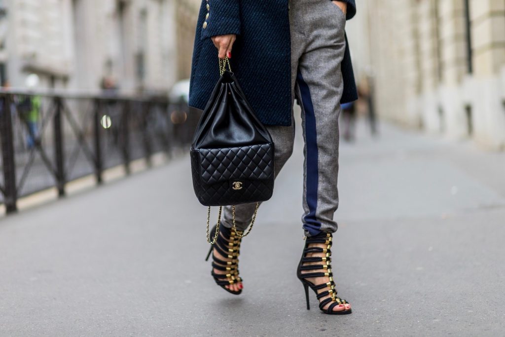PARIS, FRANCE - SEPTEMBER 30: German fashion blogger and model Alexandra Lapp (@alexandralapp_) wearing Navy Coature, a blouse, grey pants, navy coat and hat from Marc Aurel, strap sandals from Balmain H&M and black Chanel backpack on September 30, 2016 in Paris, France. (Photo by Christian Vierig/Getty Images) *** Local Caption *** Alexandra Lapp