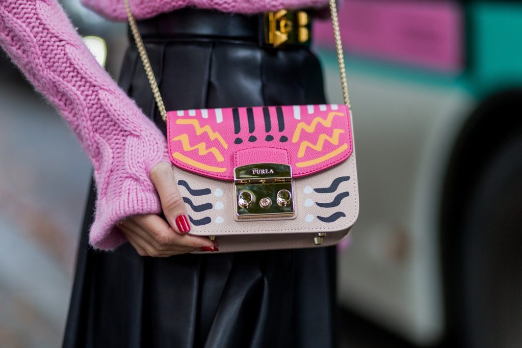 Jil Sander, Steffen Schraut, Celine, Furla, Alaïa, Hermès PARIS, FRANCE - OCTOBER 01: German model and fashion blogger Alexandra Lapp (@alexandralapp_) wearing a pink sweater from Jil Sander, leather pleated skirt from Steffen Schraut, overknees from Alaia, Celine sunglasses, Hermes belt, pink Furla bag on October 1, 2016 in Paris, France. (Photo by Christian Vierig/Getty Images) *** Local Caption *** Alexandra Lapp