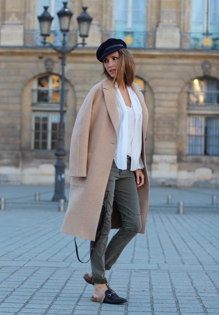 Place Vendôme, PARIS, FRANCE - NOVEMBER : German model and fashion blogger Alexandra Lapp (@alexandralapp_) wearing a camel coat, tie neck blouse and pants by Marc Aurel, princetown slippers from Gucci and peekaboo mini bag from Fendi, on November 2016 in Paris, France. *** Local Caption *** Alexandra Lapp