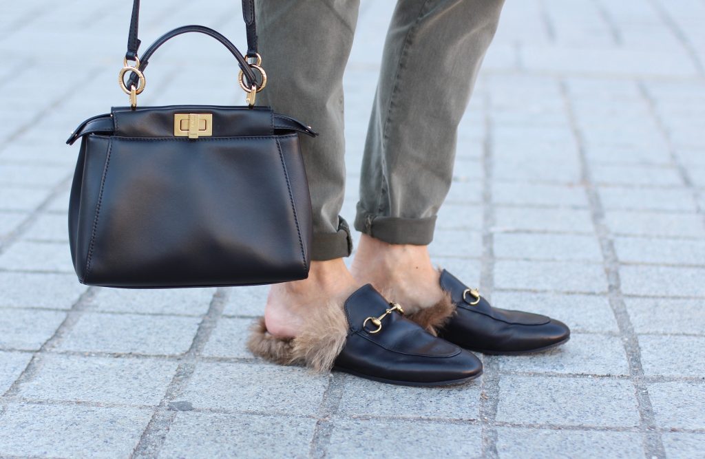 Place Vendôme, PARIS, FRANCE - NOVEMBER : German model and fashion blogger Alexandra Lapp (@alexandralapp_) wearing a camel coat, tie neck blouse and pants by Marc Aurel, princetown slippers from Gucci and peekaboo mini bag from Fendi, on November 2016 in Paris, France. *** Local Caption *** Alexandra Lapp