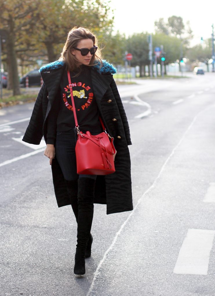 DÜSSELDORF; GERMANY - DEZEMBER : German model and fashion blogger Alexandra Lapp (@alexandralapp_) wearing Kenzo x H&M sweater and coat Céline sunglasses, Gianvito Rossi overknees and Camelia Roma bag on Dezember, 2016 in Germany*** Local Caption *** Alexandra Lapp