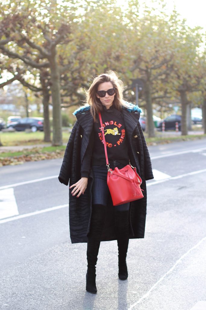 DÜSSELDORF; GERMANY - DEZEMBER : German model and fashion blogger Alexandra Lapp (@alexandralapp_) wearing Kenzo x H&M sweater and coat Céline sunglasses, Gianvito Rossi overknees and Camelia Roma bag on Dezember, 2016 in Germany*** Local Caption *** Alexandra Lapp