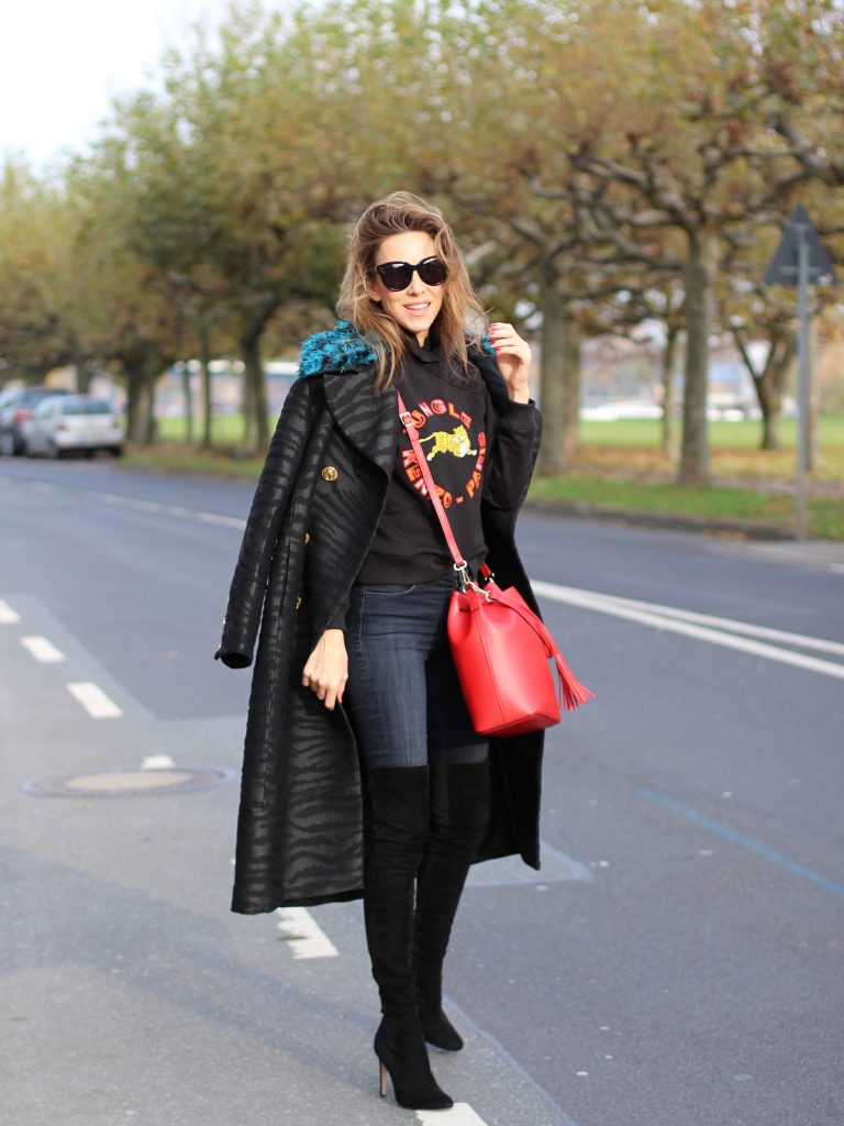 DÜSSELDORF; GERMANY - DEZEMBER : German model and fashion blogger Alexandra Lapp (@alexandralapp_) wearing Kenzo x H&M sweater and coat Céline sunglasses, Gianvito Rossi overknees and Camelia Roma bag on Dezember, 2016 in Germany*** Local Caption *** Alexandra Lapp