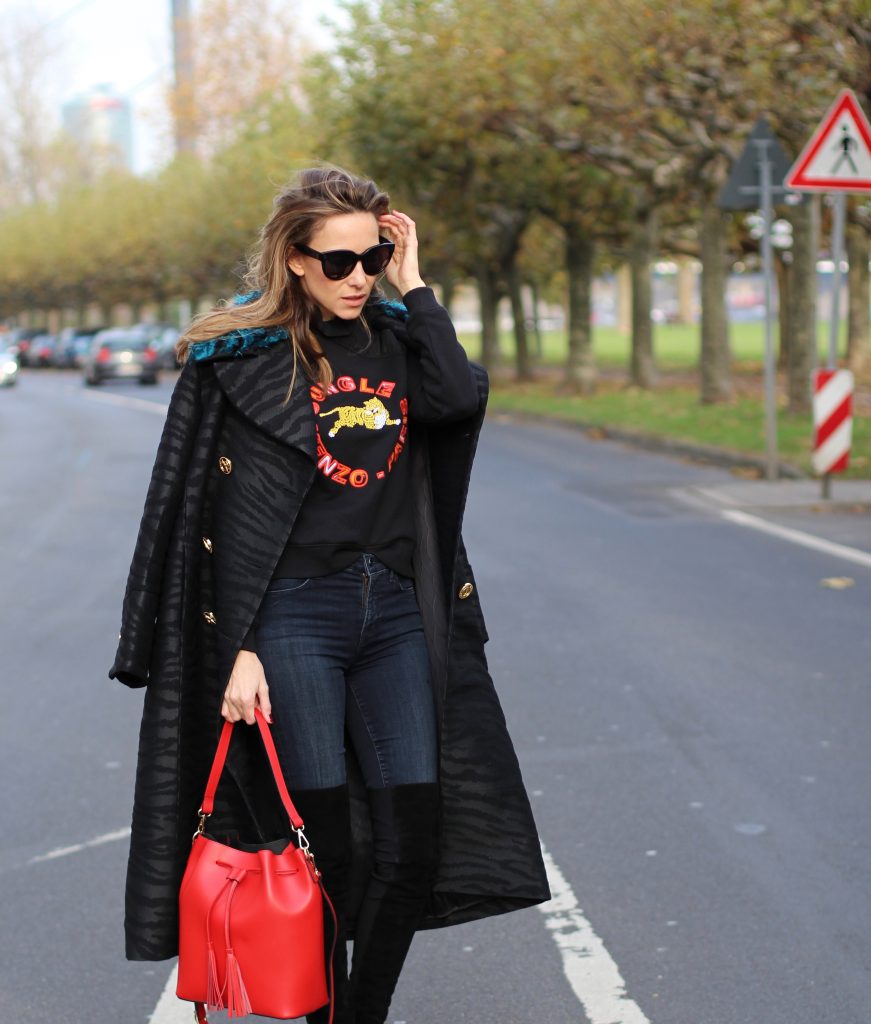 DÜSSELDORF; GERMANY - DEZEMBER : German model and fashion blogger Alexandra Lapp (@alexandralapp_) wearing Kenzo x H&M sweater and coat Céline sunglasses, Gianvito Rossi overknees and Camelia Roma bag on Dezember, 2016 in Germany*** Local Caption *** Alexandra Lapp
