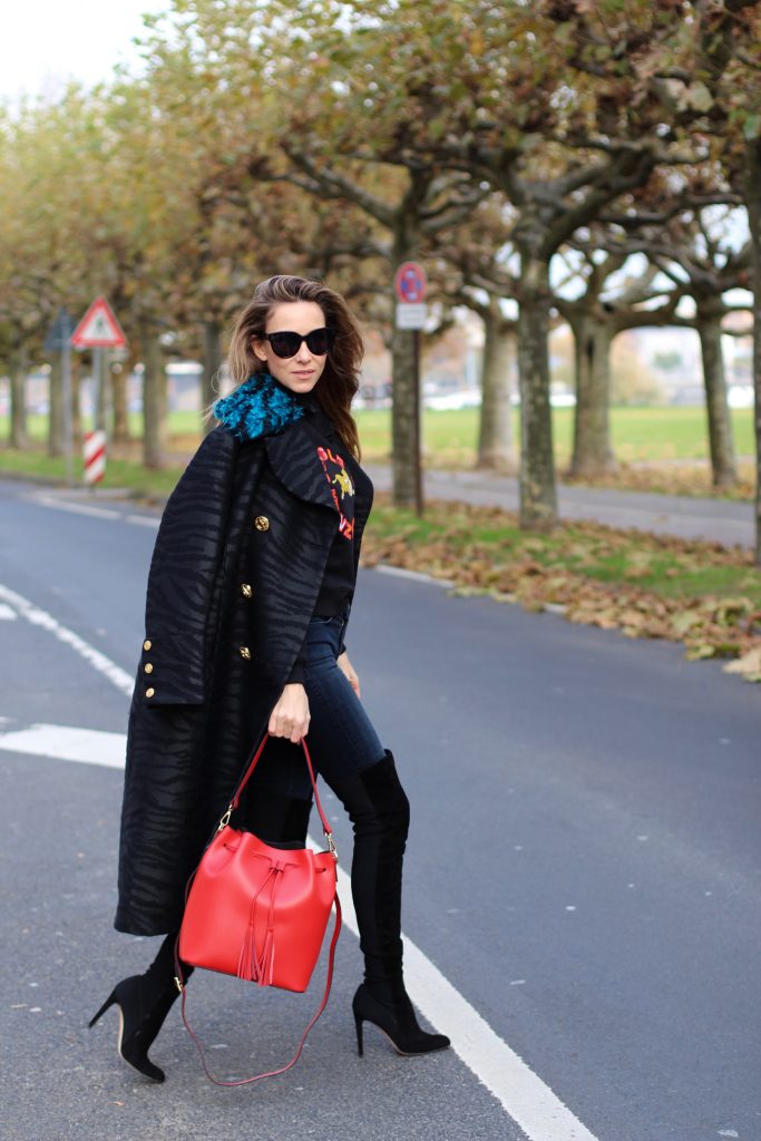 DÜSSELDORF; GERMANY - DEZEMBER : German model and fashion blogger Alexandra Lapp (@alexandralapp_) wearing Kenzo x H&M sweater and coat Céline sunglasses, Gianvito Rossi overknees and Camelia Roma bag on Dezember, 2016 in Germany*** Local Caption *** Alexandra Lapp