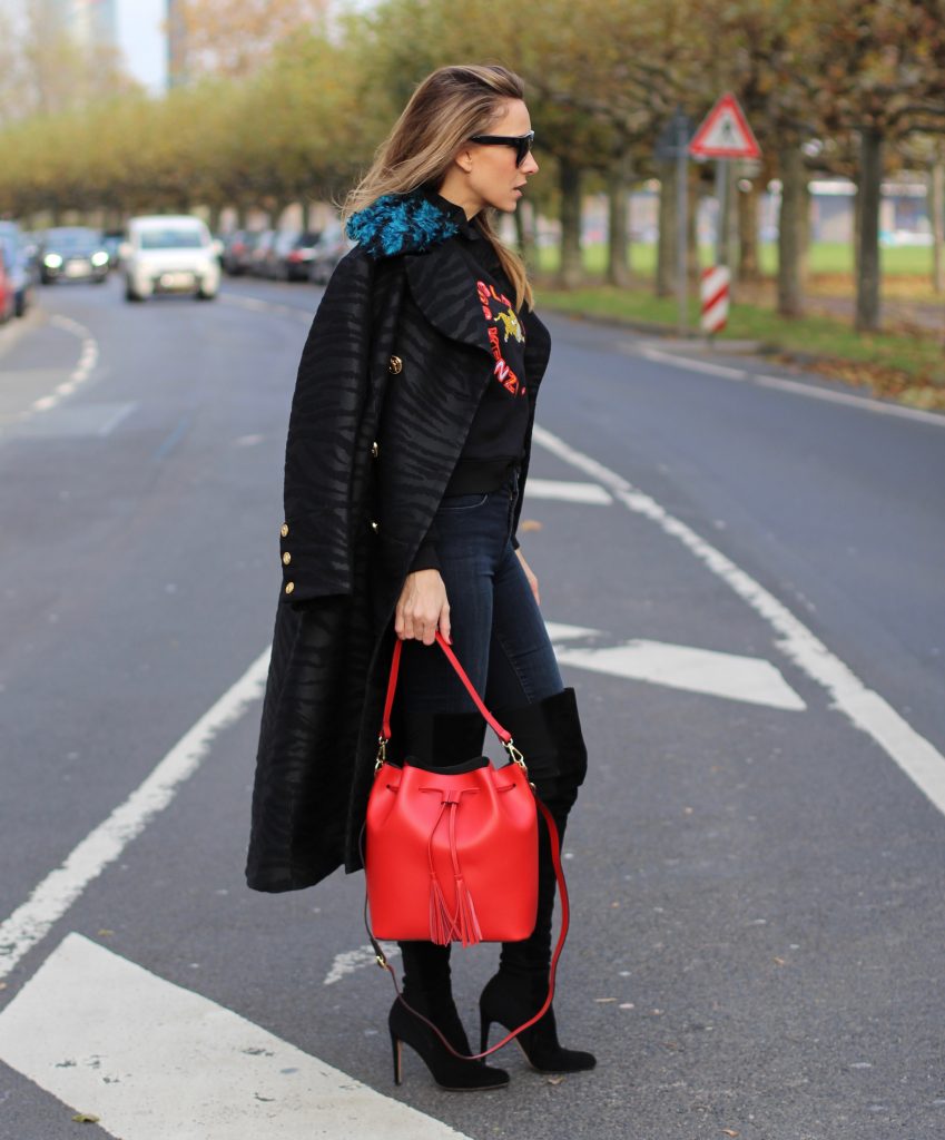 DÜSSELDORF; GERMANY - DEZEMBER : German model and fashion blogger Alexandra Lapp (@alexandralapp_) wearing Kenzo x H&M sweater and coat Céline sunglasses, Gianvito Rossi overknees and Camelia Roma bag on Dezember, 2016 in Germany*** Local Caption *** Alexandra Lapp