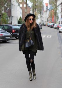 DÜSSELDORF; GERMANY - DEZEMBER : German model and fashion blogger Alexandra Lapp (@alexandralapp_) wearing brocade booties by Ash, destroyed denim pants from Frame, Celine turtleneck, Prada fur jacket, Dorfman Pacific hat, Monokel eyewear and a Fendi bag on Dezember, 2016 in Germany*** Local Caption *** Alexandra Lapp