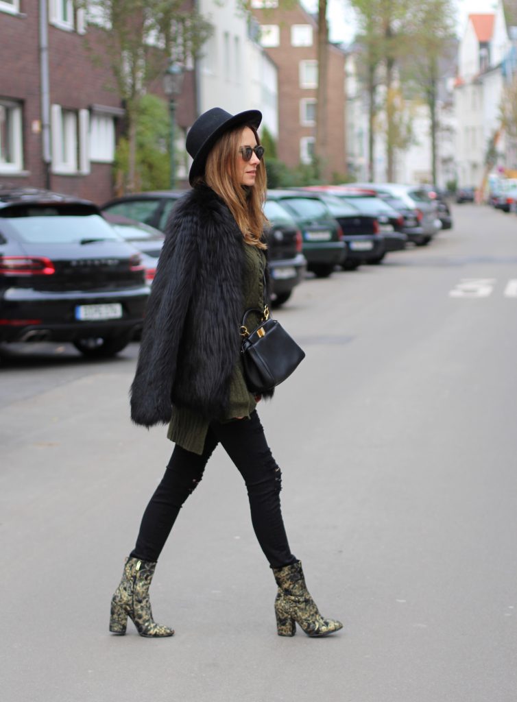 Ash, Prada, Fendi, Celine, Dorfman Pacific, Monokel DÜSSELDORF; GERMANY - DEZEMBER : German model and fashion blogger Alexandra Lapp (@alexandralapp_) wearing brocade booties by Ash, destroyed denim pants from Frame, Celine turtleneck, Prada fur jacket, Dorfman Pacific hat, Monokel eyewear and a Fendi bag on Dezember, 2016 in Germany*** Local Caption *** Alexandra Lapp