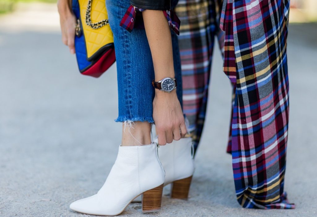 PARIS, FRANCE - OCTOBER 03: German fashion blogger and model Alexandra Lapp (@alexandralapp_) wearing layer love, Levis denim jeans, a white James Perse tshirt, L'Agence plaid dress, white Zara shoes, Ray Ban sunglasses, Schott NYC leather jacket, Chanel bag on October 3, 2016 in Paris, France. (Photo by Christian Vierig/Getty Images) *** Local Caption *** Alexandra Lapp