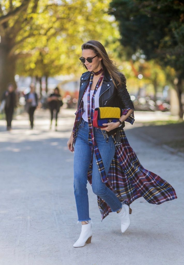 PARIS, FRANCE - OCTOBER 03: German fashion blogger and model Alexandra Lapp (@alexandralapp_) wearing layer love, Levis denim jeans, a white James Perse tshirt, L'Agence plaid dress, white Zara shoes, Ray Ban sunglasses, Schott NYC leather jacket, Chanel bag on October 3, 2016 in Paris, France. (Photo by Christian Vierig/Getty Images) *** Local Caption *** Alexandra Lapp