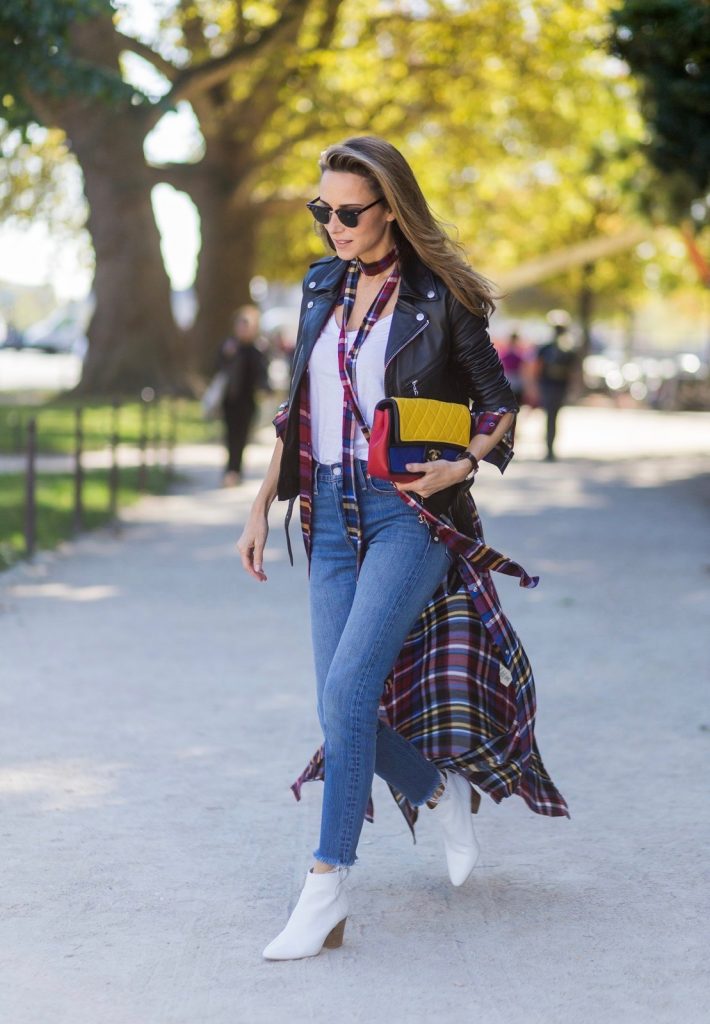 PARIS, FRANCE - OCTOBER 03: German fashion blogger and model Alexandra Lapp (@alexandralapp_) wearing layer love, Levis denim jeans, a white James Perse tshirt, L'Agence plaid dress, white Zara shoes, Ray Ban sunglasses, Schott NYC leather jacket, Chanel bag on October 3, 2016 in Paris, France. (Photo by Christian Vierig/Getty Images) *** Local Caption *** Alexandra Lapp