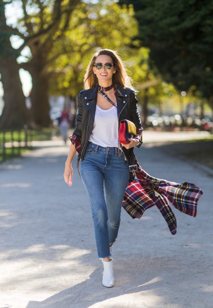 PARIS, FRANCE - OCTOBER 03: German fashion blogger and model Alexandra Lapp (@alexandralapp_) wearing layer love, Levis denim jeans, a white James Perse tshirt, L'Agence plaid dress, white Zara shoes, Ray Ban sunglasses, Schott NYC leather jacket, Chanel bag on October 3, 2016 in Paris, France. (Photo by Christian Vierig/Getty Images) *** Local Caption *** Alexandra Lapp
