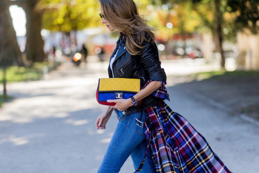 PARIS, FRANCE - OCTOBER 03: German fashion blogger and model Alexandra Lapp (@alexandralapp_) wearing layer love, Levis denim jeans, a white James Perse tshirt, L'Agence plaid dress, white Zara shoes, Ray Ban sunglasses, Schott NYC leather jacket, Chanel bag on October 3, 2016 in Paris, France. (Photo by Christian Vierig/Getty Images) *** Local Caption *** Alexandra Lapp