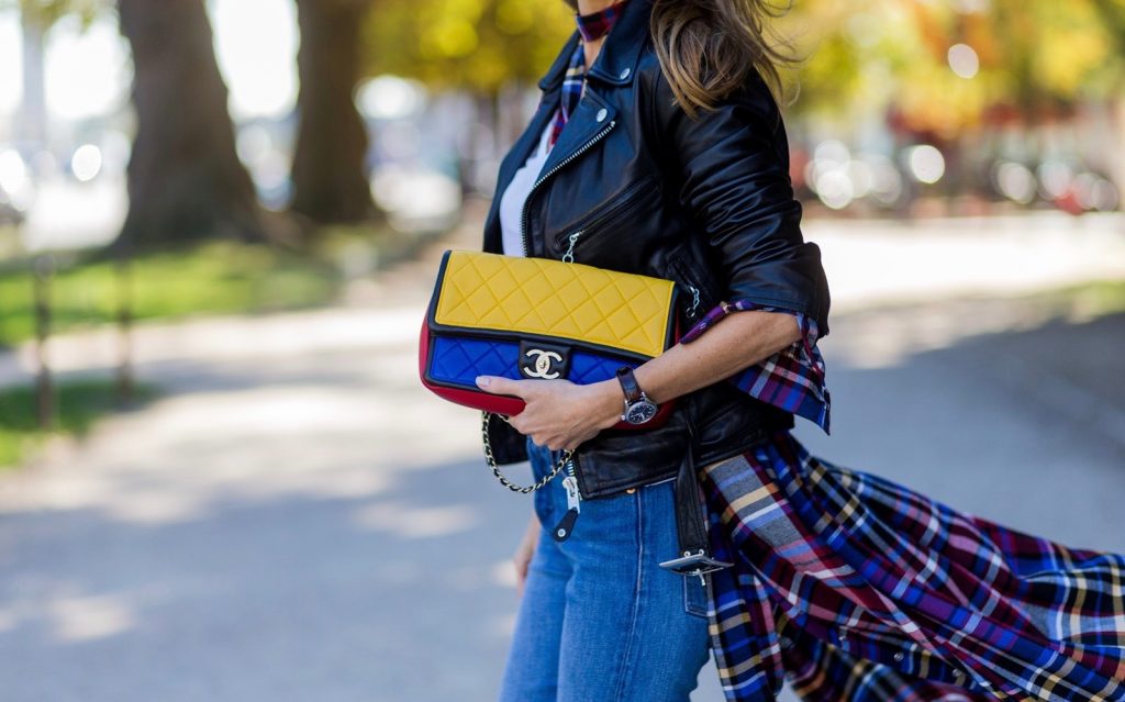 PARIS, FRANCE - OCTOBER 03: German fashion blogger and model Alexandra Lapp (@alexandralapp_) wearing layer love, Levis denim jeans, a white James Perse tshirt, L'Agence plaid dress, white Zara shoes, Ray Ban sunglasses, Schott NYC leather jacket, Chanel bag on October 3, 2016 in Paris, France. (Photo by Christian Vierig/Getty Images) *** Local Caption *** Alexandra Lapp
