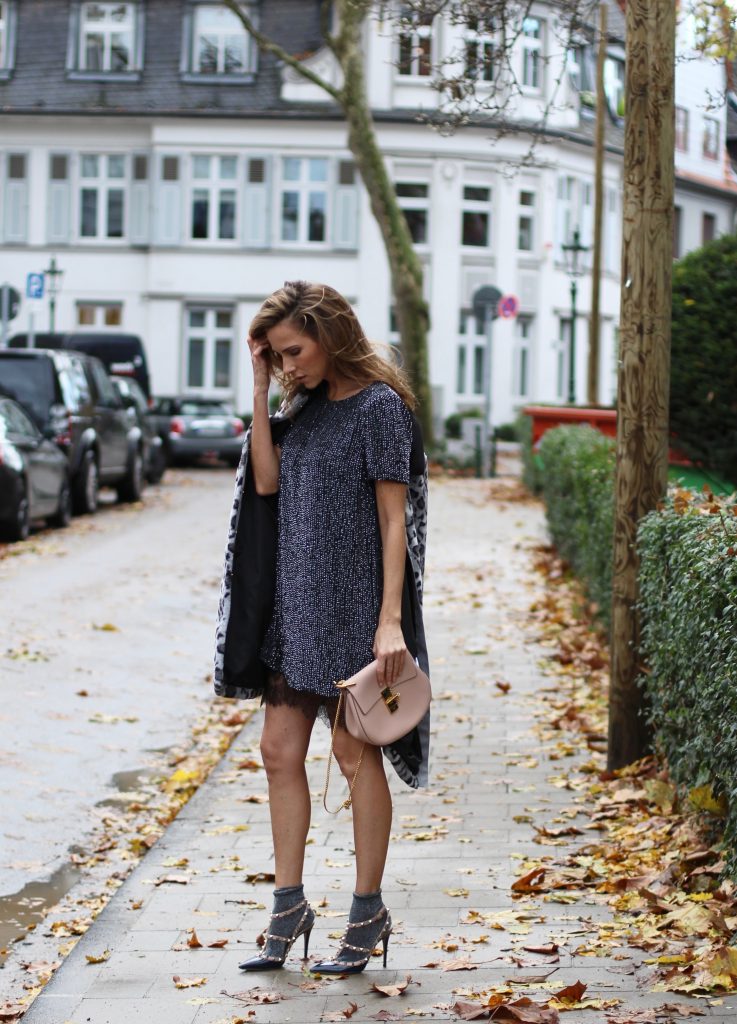 DÜSSELDORF; GERMANY - DEZEMBER : German model and fashion blogger Alexandra Lapp (@alexandralapp_) wearing glitter socks by Forever 21, glitter dress from Marciano Guess, neglige from Agent Provocateur, faux fur, fake fur from Patricia Pepe, rockstud pumps by Valentino and a Chloe bag on Dezember, 2016 in Germany*** Local Caption *** Alexandra Lapp
