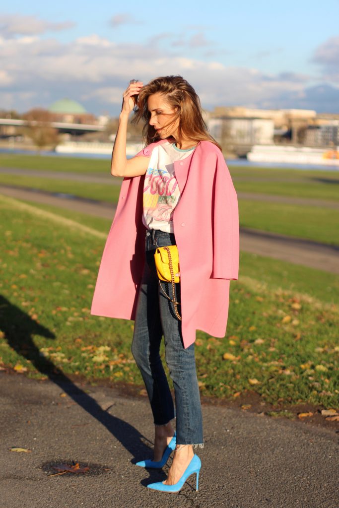 DÜSSELDORF; GERMANY - DEZEMBER : German model and fashion blogger Alexandra Lapp (@alexandralapp_) wearing a Coco Cuba T-shirt from Chanel, high waist denim from Levi's, cashmere coat from Prada, rockstud pumps by Gianvito Rossi and a yellow GG Marmont Mini bag by Gucci on Dezember, 2016 in Germany*** Local Caption *** Alexandra Lapp