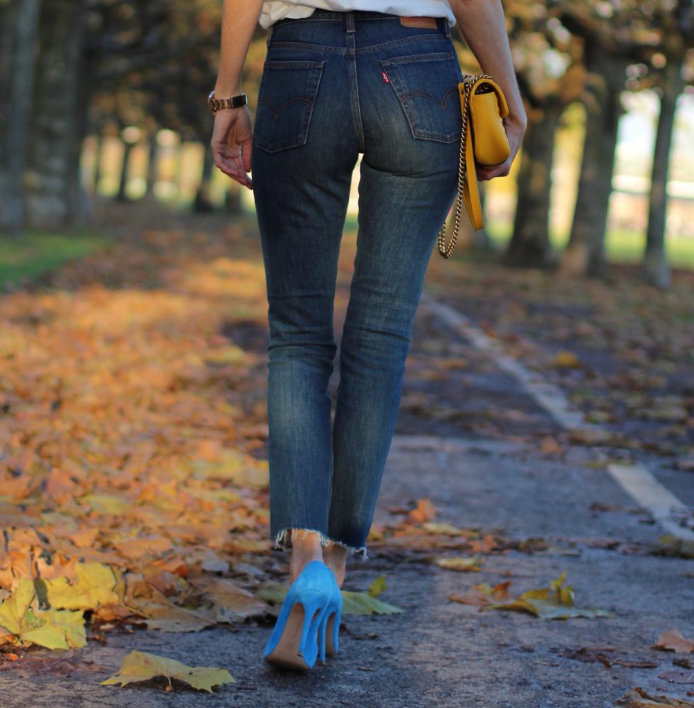 DÜSSELDORF; GERMANY - DEZEMBER : German model and fashion blogger Alexandra Lapp (@alexandralapp_) wearing a Coco Cuba T-shirt from Chanel, high waist denim from Levi's, cashmere coat from Prada, rockstud pumps by Gianvito Rossi and a yellow GG Marmont Mini bag by Gucci on Dezember, 2016 in Germany*** Local Caption *** Alexandra Lapp