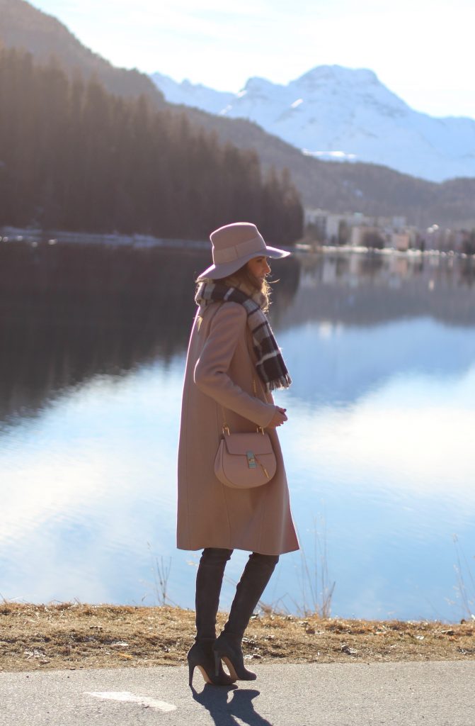 Sankt Moritz, Marc Cain, Gianvito Rossi, Chloé, IWC SANKT MORITZ - DEZEMBER : German model and fashion blogger Alexandra Lapp (@alexandralapp_) wearing Marc Cain in St. Moritz, an off white turtleneck, grey slim jeans, a beige cashmere coat, scarf and hat by Marc Cain, overknee boots in grey from Gianvito Rossi, IWC watch and a bag by Chloe on Dezember, 2016 in Sankt Moritz *** Local Caption *** Alexandra Lapp