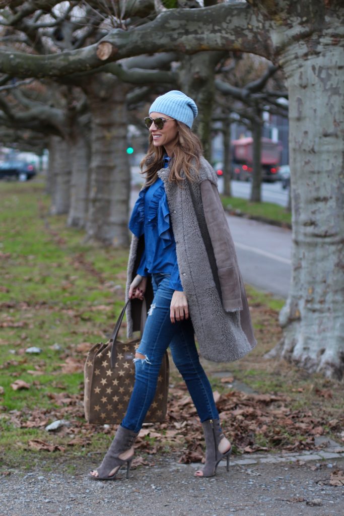 DÜSSELDORF; GERMANY - DEZEMBER : German model and fashion blogger Alexandra Lapp (@alexandralapp_) wearing denim on denim, a denim blouse from Storets, denim by Adriano Goldschmied, velvet booties by Halston, a baby blue beanie from Marc Cain, sunglasses by Le Specs, coat and bag by Steffen Schraut on Dezember, 2016 in Germany*** Local Caption *** Alexandra Lapp