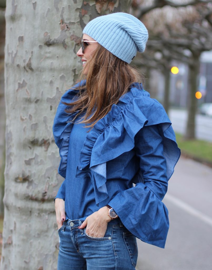 DÜSSELDORF; GERMANY - DEZEMBER : German model and fashion blogger Alexandra Lapp (@alexandralapp_) wearing denim on denim, a denim blouse from Storets, denim by Adriano Goldschmied, velvet booties by Halston, a baby blue beanie from Marc Cain, sunglasses by Le Specs, coat and bag by Steffen Schraut on Dezember, 2016 in Germany*** Local Caption *** Alexandra Lapp